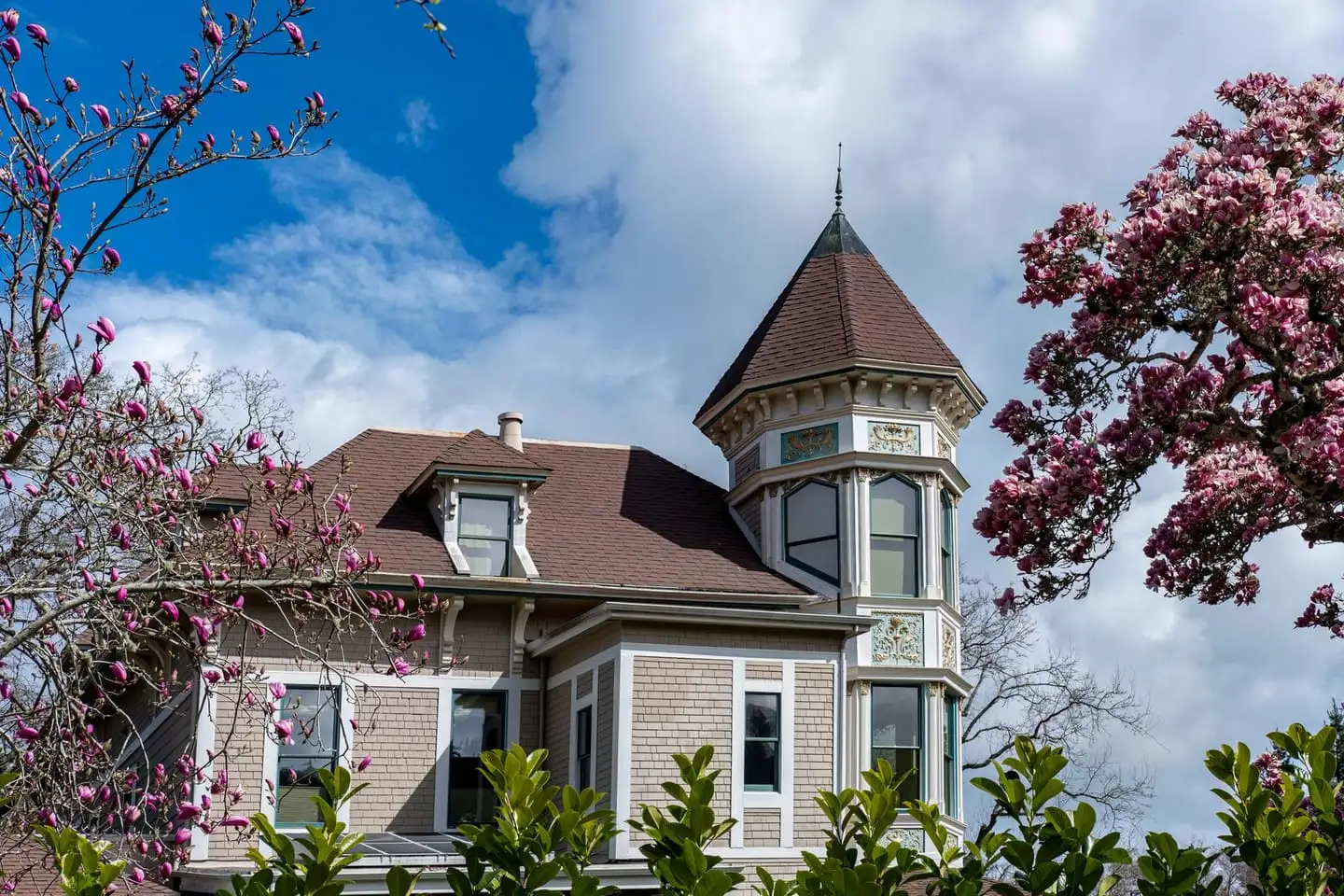 A period family house with a front garden in spring, the kind of property sold at an estate auction.